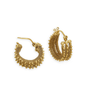 A pair of ornate gold hoop earrings.