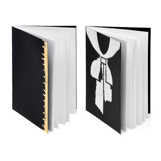 A5 notebook duo featuring iconic Schiaparelli motif, one a detail from Elsa's pioneering trompe l'oeil jumper, and the other Schiaparelli's contemporary signature gold measuring tape