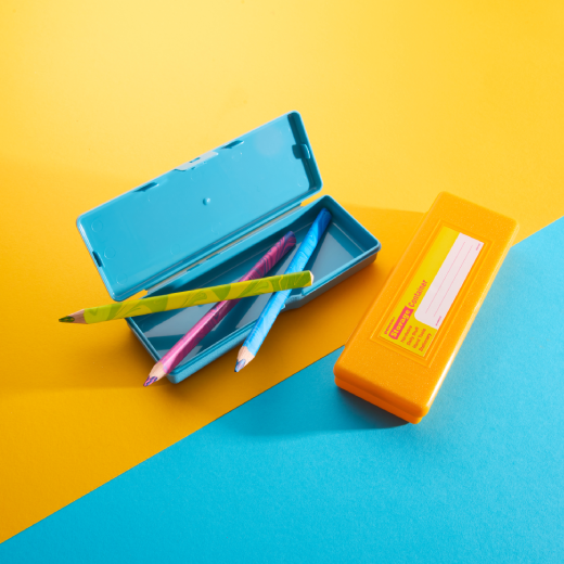 A blue penco Storage Container shown open with pencils as well as a yellow version closed