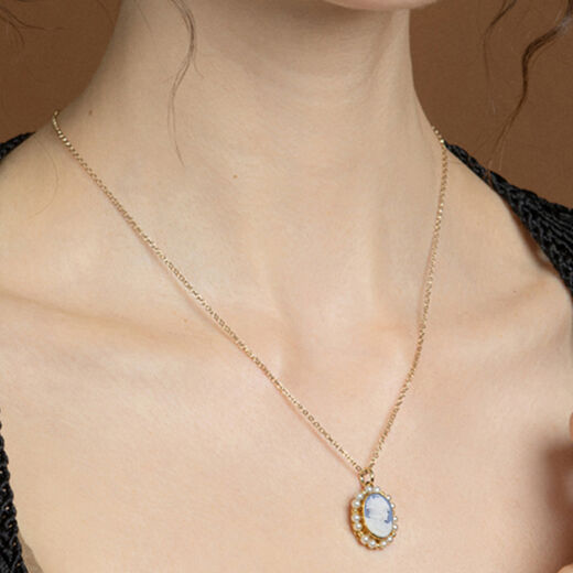 Hand-carved porcelain cameo necklace by Vintouch