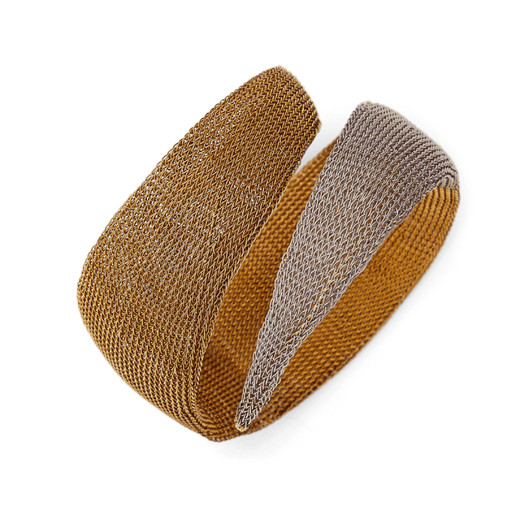 A woven mesh bracelet in contrasting gold and silver tones.