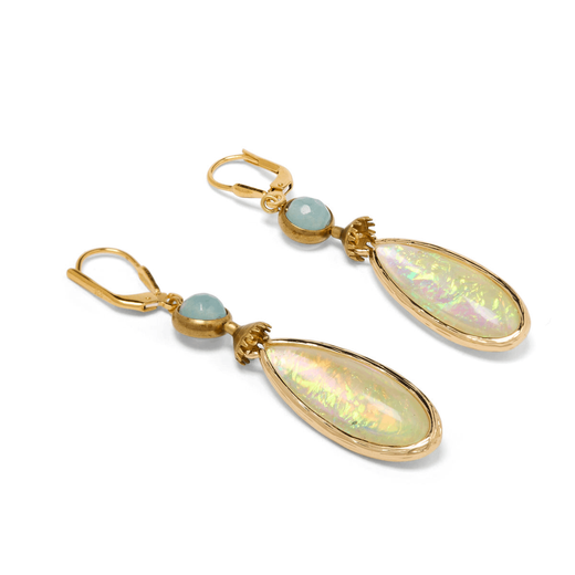 A pair of drop earrings featuring iridiscent drops of green resin.