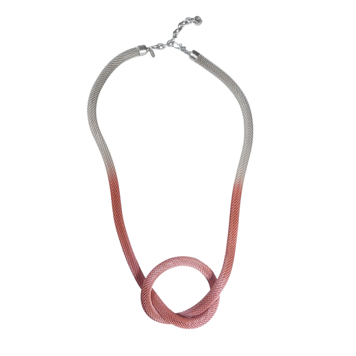 A knotted silver and pink mesh necklace.