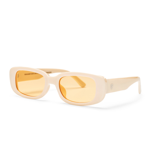 Sunglasses with a cream coloured thick frame and pale yellow lenses, seen from the side.