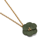 A gree, flower shaped necklace pendant on a gold chain.