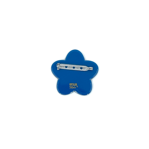 A blue flower shaped brooch seen from the back.