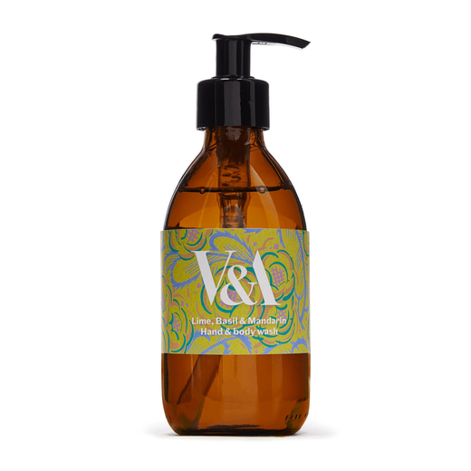 A brown glass bottle with a black pump and a green label. Printed on the label are a floral pattern and the V&A logo in white.