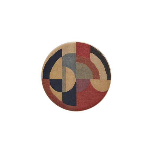 Round ceramic brooch featuring an art deco pattern in red, blue and cream colours.