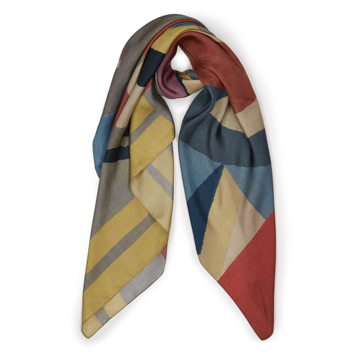Wrapped scarf with a dusty blue, red and yellow geometric pattern.