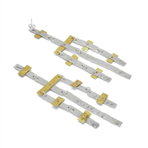 Mixed metal statement earrings by Kate Trouw