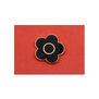 Mary Quant black flower magnet