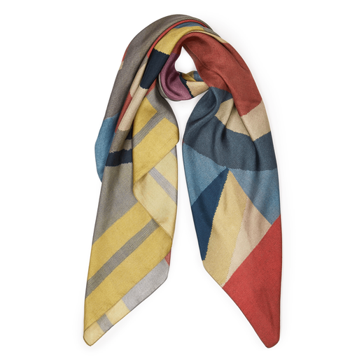 Wrapped scarf with a dusty blue, red and yellow geometric pattern.