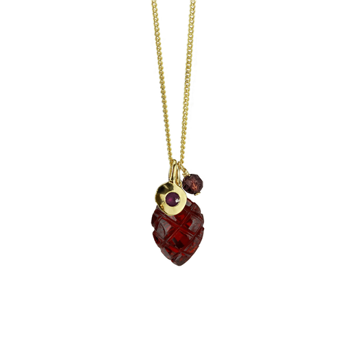Gold chain necklace with a pendant made of three red stones.