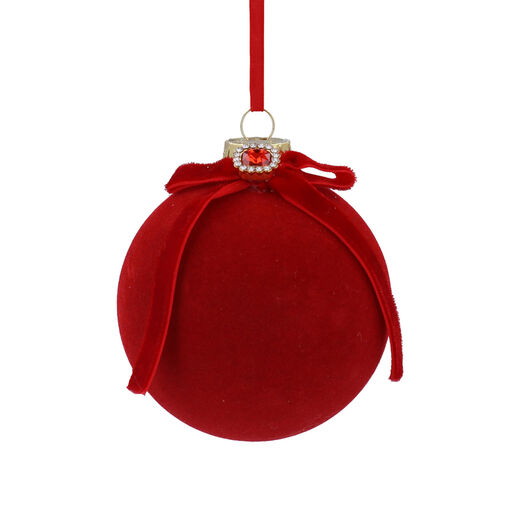 Bright christmas bauble covered with a red vellved fabric 
