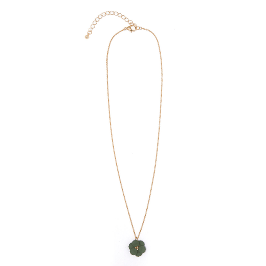 A gold chain necklace with a green flower shape pendant.