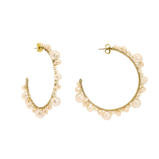 A pair of gold hoop earrings with white pearls.