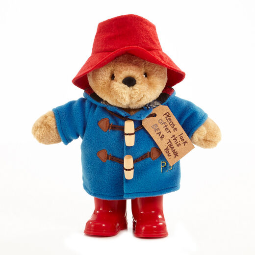 Paddington plush toy with blue jacket and red hat and boot