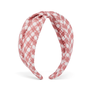 Fabric headband featuring a white and pink check pattern.