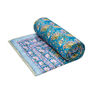 A rolled quilt featuring a floral pattern in pink, purple and blue shades.