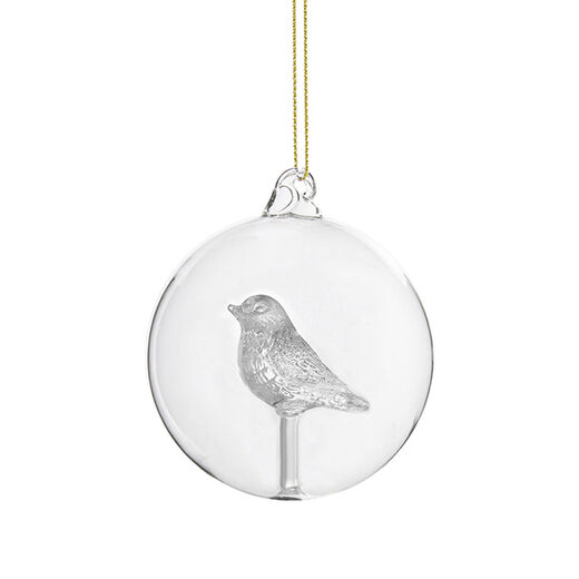 Glass bauble with a bird nestled inside
