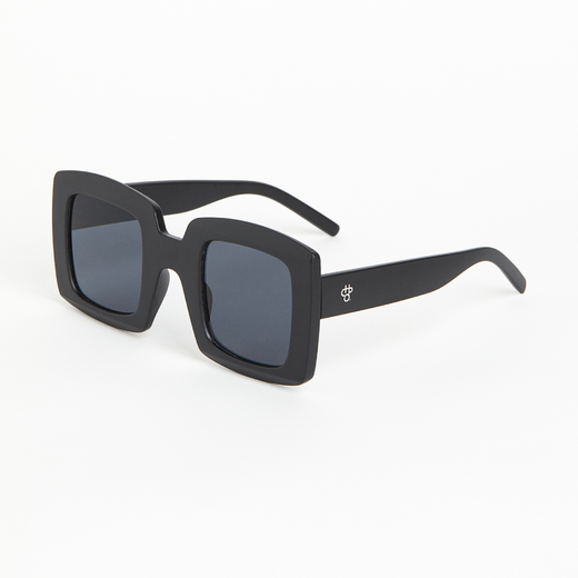 Chunky black sunglasses with dark lenses, seen from the side.