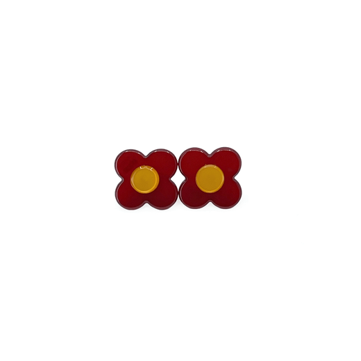 A pair of flower shaped stud earrings, with a yellow centre and red petals.