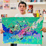 ARTHOUSE Unlimited artist David Bell holding up his abstract artwork to the camera.