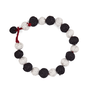 Bracelet composed of black and white fabric beads and red fabric clasp.