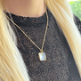 Carved rock crystal pendant necklace by Mirabelle