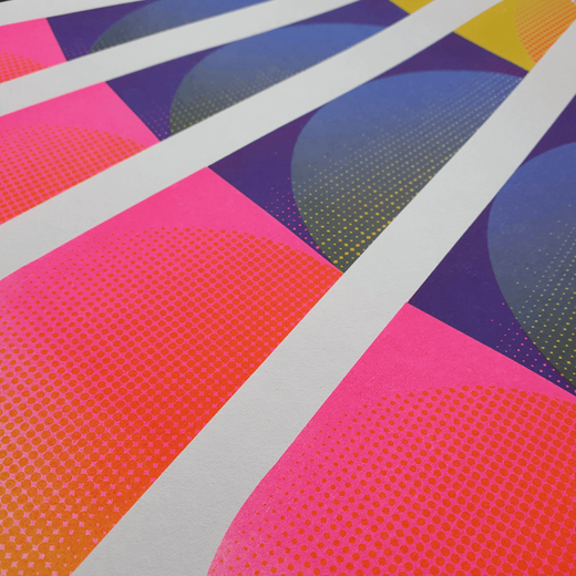 Detail of a risograph print featuring colourful geometric shapes in hot pink and blue.