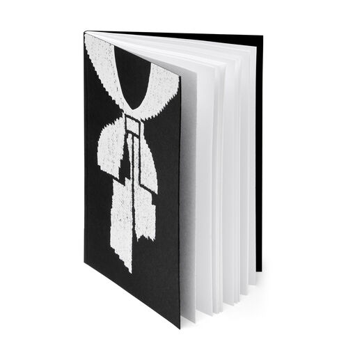 Pocket size notebook with illustration of iconic illusory cravat jumper design on the front cover 