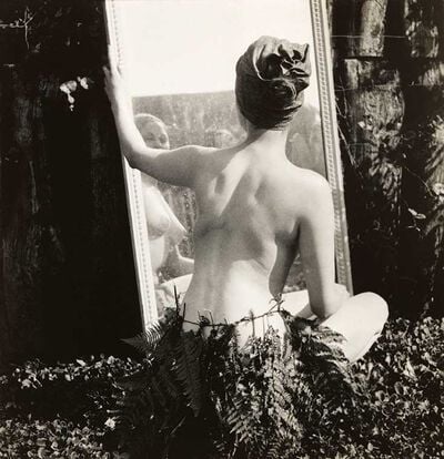 Female nude in fern leaf skirt