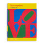A hardback book featuring with the word 'love' in bright red capital letters on a yellow, green and blue background.