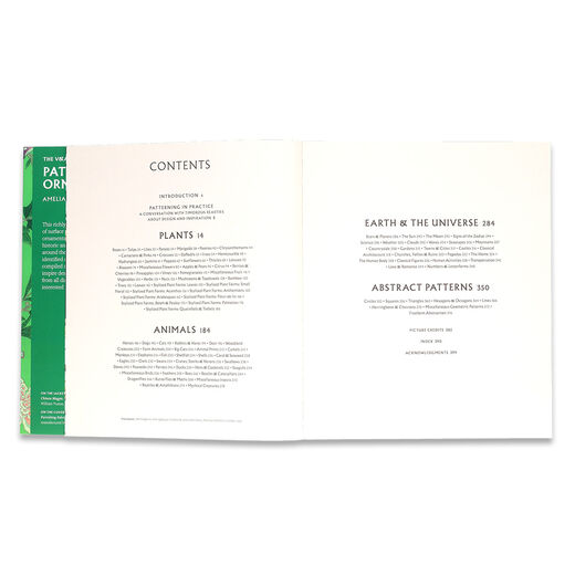 A green book open to the table of contents.