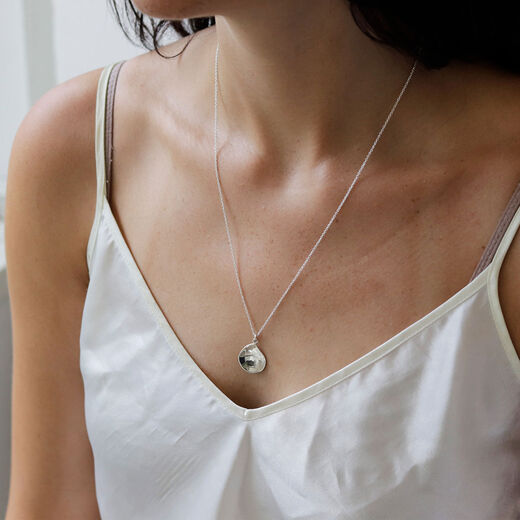 Silver teardrop pendant necklace by Mounir