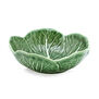 A quirky glazed earthenware dish in the form of a cabbage leaf - a humble homage to nature for food lovers.