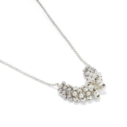 A close up of the beaded pendant.