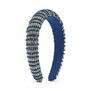 A blue headband encrusted with glass beads arranged in a striped pattern.