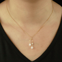 Pearl horseshoe drop necklace by Mounir