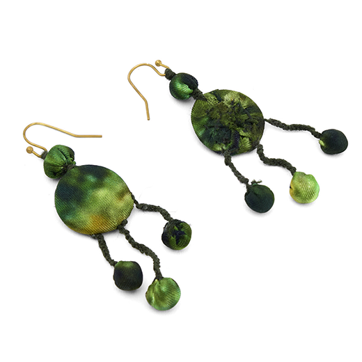 A pair of green hook earrings are made using silk offcuts. One of the two earrings is turned upside down to show its back.