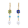 A pair of earrings adorned with blue and yellow Murano glass beads and faux pearls.
