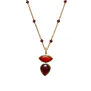 Gold rosary chain necklace with a pendant featuring two orange and purple oval stones.