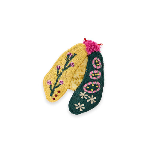 Recycled textile and embroidered brooch featuring a moth