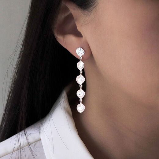 Silver teardrop long earrings by Mounir