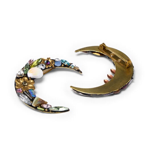 Two brooches in the shape of a crescent moon. One is made of colourful stones and glass beads while the other is turned to show the clasp at its back.