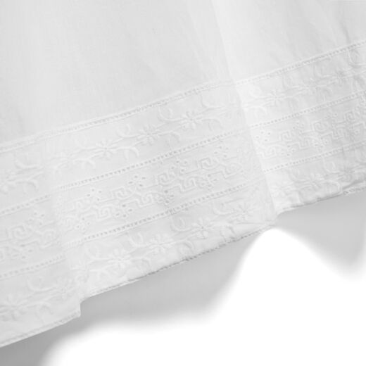 White cotton nightdress featuring a lovely embroidery along the bottom hem.
