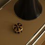 A small trinket box on a bedside table.