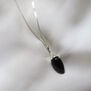 Black onyx acorn pendant necklace by Mounir