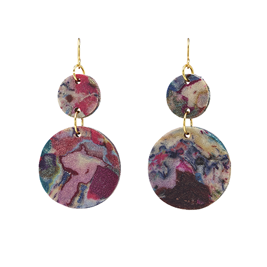 A pair of hook earrings featuring two flat round pendants in different sizes, each featuring a marbled multicoloured pattern.