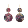 A pair of hook earrings featuring two flat round pendants in different sizes, each featuring a marbled multicoloured pattern.
